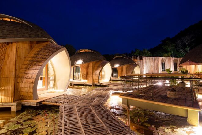 A photo taken at night with the structures lit up by light within them