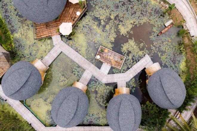 Overhead view of the structures sitting in a large pond