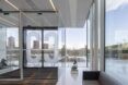 Room with glass walls facing the open sky