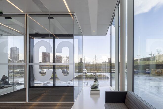Room with glass walls facing the open sky
