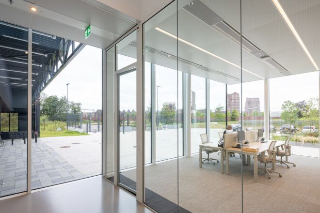 Office room divided by glass walls