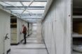 Vault hallway with a man opening up a section