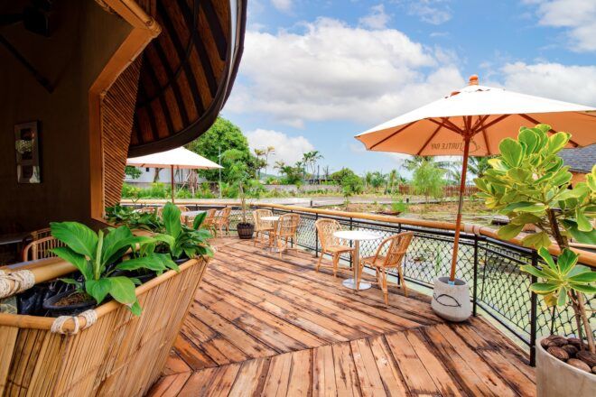 Outside patio area with tables, chairs and umbrellas