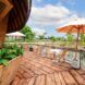 Outside patio area with tables, chairs and umbrellas