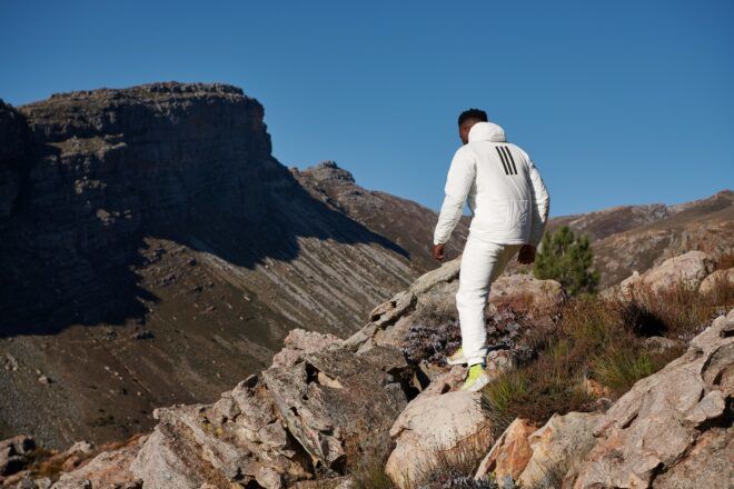 A man walking through a rocky landscape