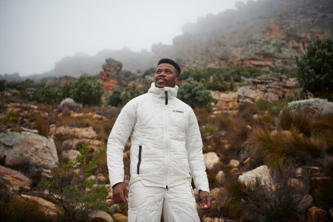 A man standing wearing a white puff jacket