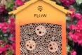 A yellow/orange Flow Pollinator House.