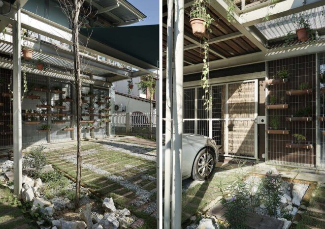 To the left, a green courtyard. To the right, a parking area next to a home.