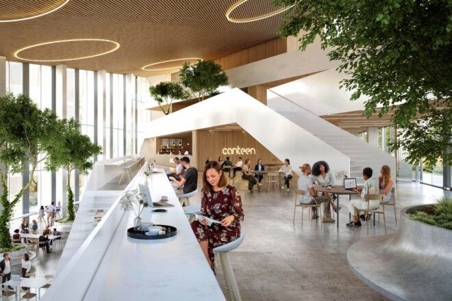 A two-level sitting and dining area full of people.