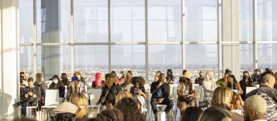 A crowd of people sitting in a room