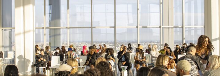 A crowd of people sitting in a room