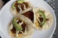 Vegan tacos with meat and topped with avocados