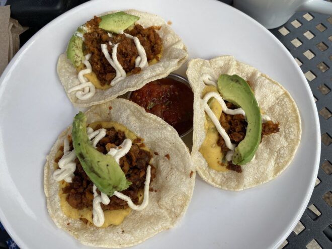Vegan tacos with meat and topped with avocados