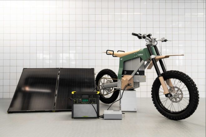 A green e-bike on a stand.