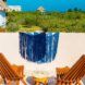 Two wood chairs looking off a deck overlooking a greenery-lined coast.