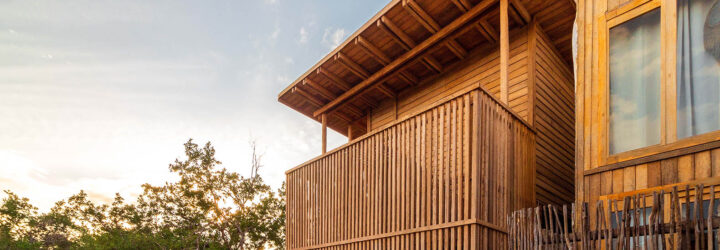The exterior of a coconut palm wood home.