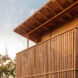 The exterior of a coconut palm wood home.