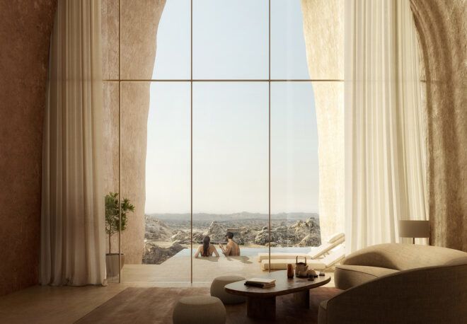A bright room with a high ceiling and glass wall.