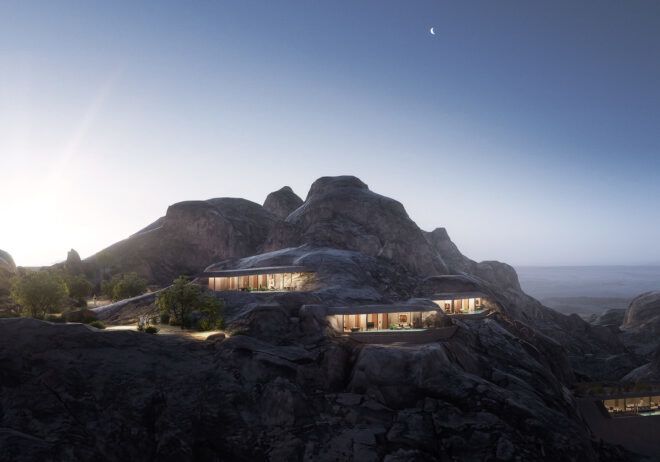 A lit-up structure built into a mountain.