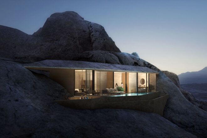 A lit-up structure built into a mountain.