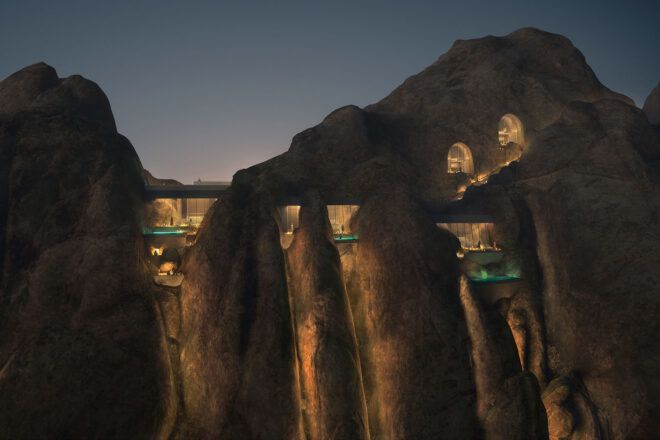 A lit-up structure built into a mountain.