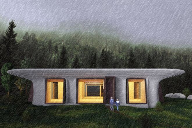 Exterior of building against a forest-y landscape