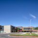 Exterior of a elementary school with a clear blue sky