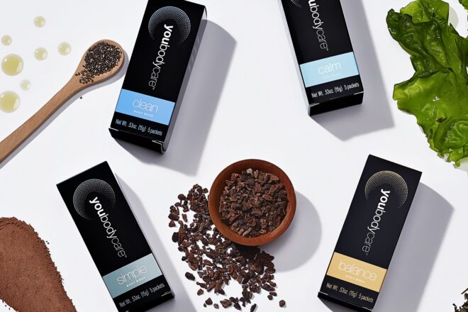 The products laid flat with a spoon, leaves and coffee grounds