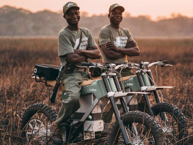 Two people on e-bikes.