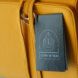 A yellow vegan leather bag with a black tag.