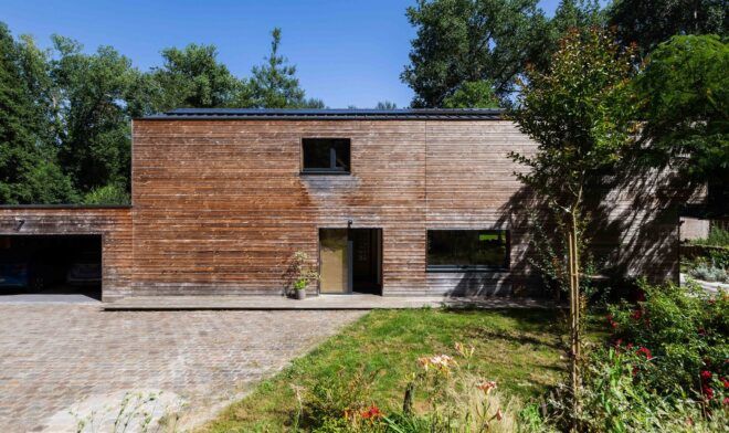 Outside side of wooden building with the drive way