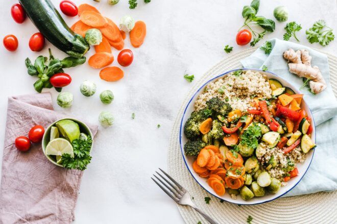 A rice bowl full of vegetables.