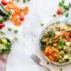A rice bowl full of vegetables.