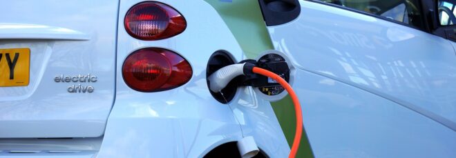 An electric car plugged in for charging