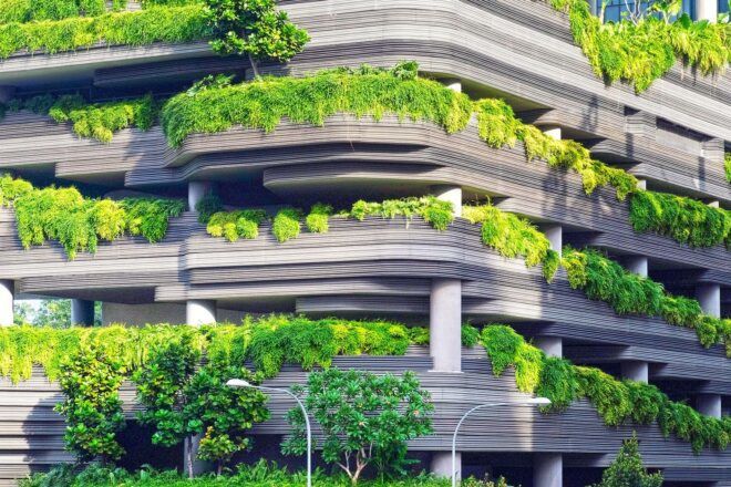 A parking garage overflowing with greenery.