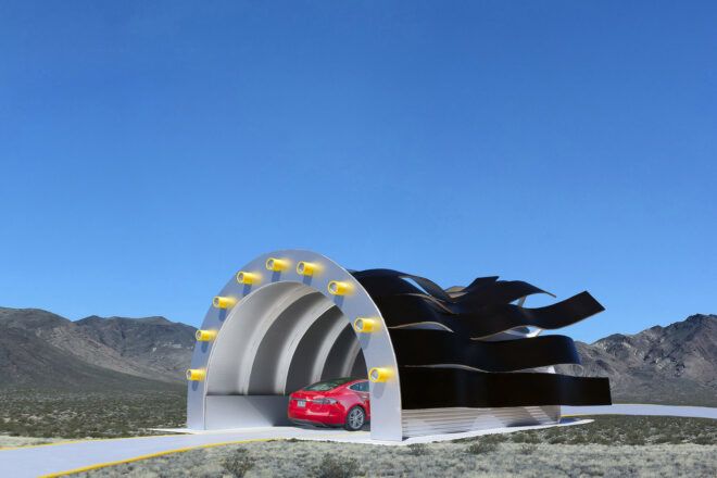 A red car entering a charging station with wavy black strips.