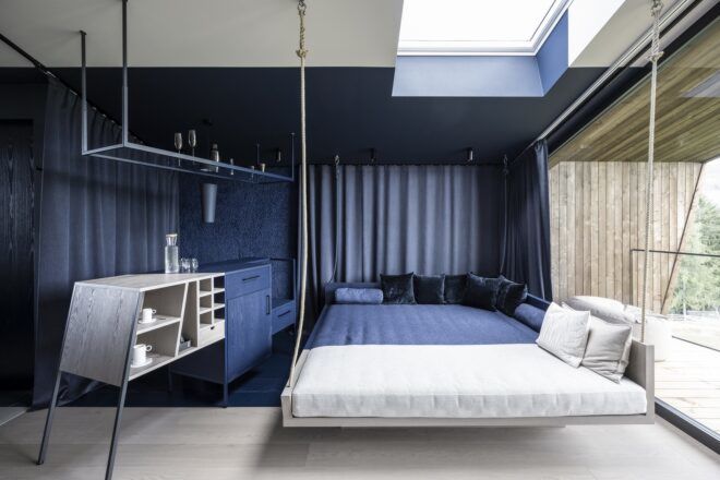 A bedroom sitting against an open window