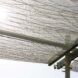 The woven canopy with light filtering through it