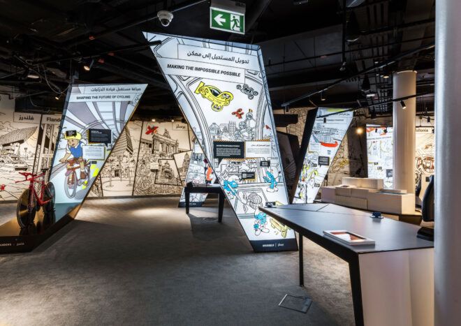 Interior exhibit within the pavilion with comic-style infographics