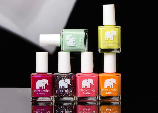 Several nail polishes stacked together.