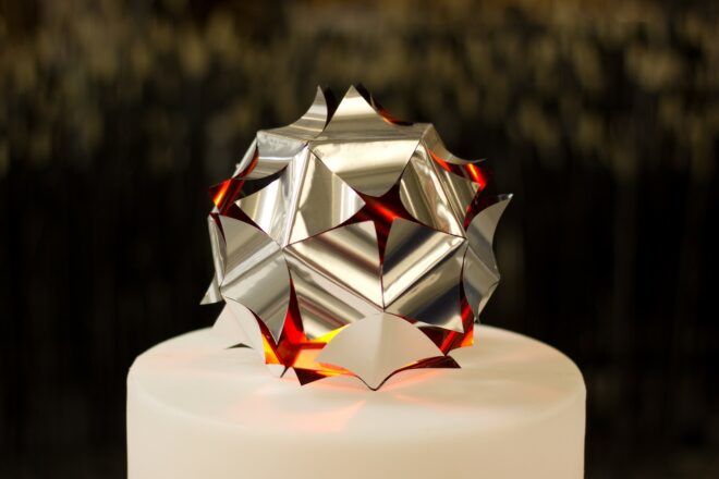 A spiky ball with cut outs in hexagonal shapes building it
