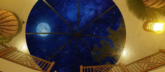 A skylight looking out at the night sky.