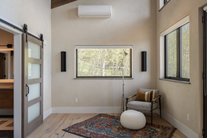 A space with a rug and a window