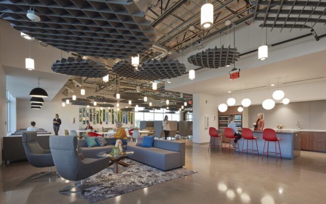 A room with a lounging area in the left and a cafeteria to the right