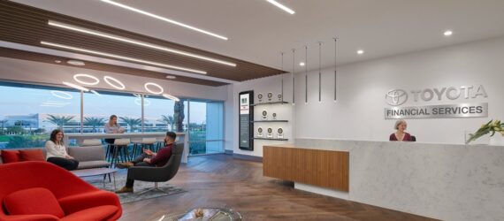 A lobby area with the name Toyota on the white wall