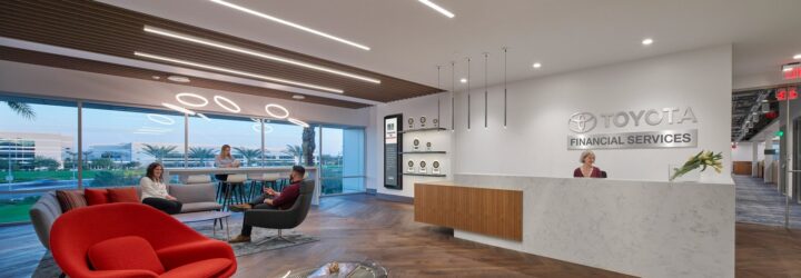 A lobby area with the name Toyota on the white wall