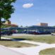 A parking lot with solar panel parking sheds.