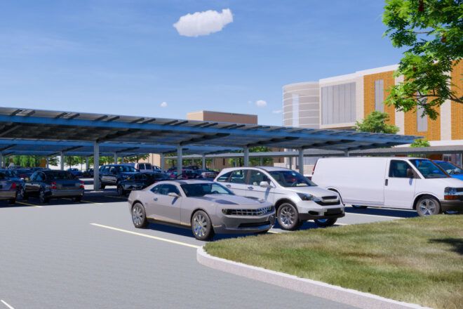 A parking lot with solar panel parking sheds.