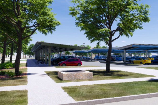 A parking lot with solar panel parking sheds.