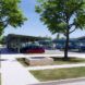 A parking lot with solar panel parking sheds.